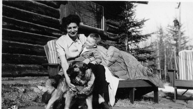 Lil Turner holding Jim Giddings and petting Rayder, 1949